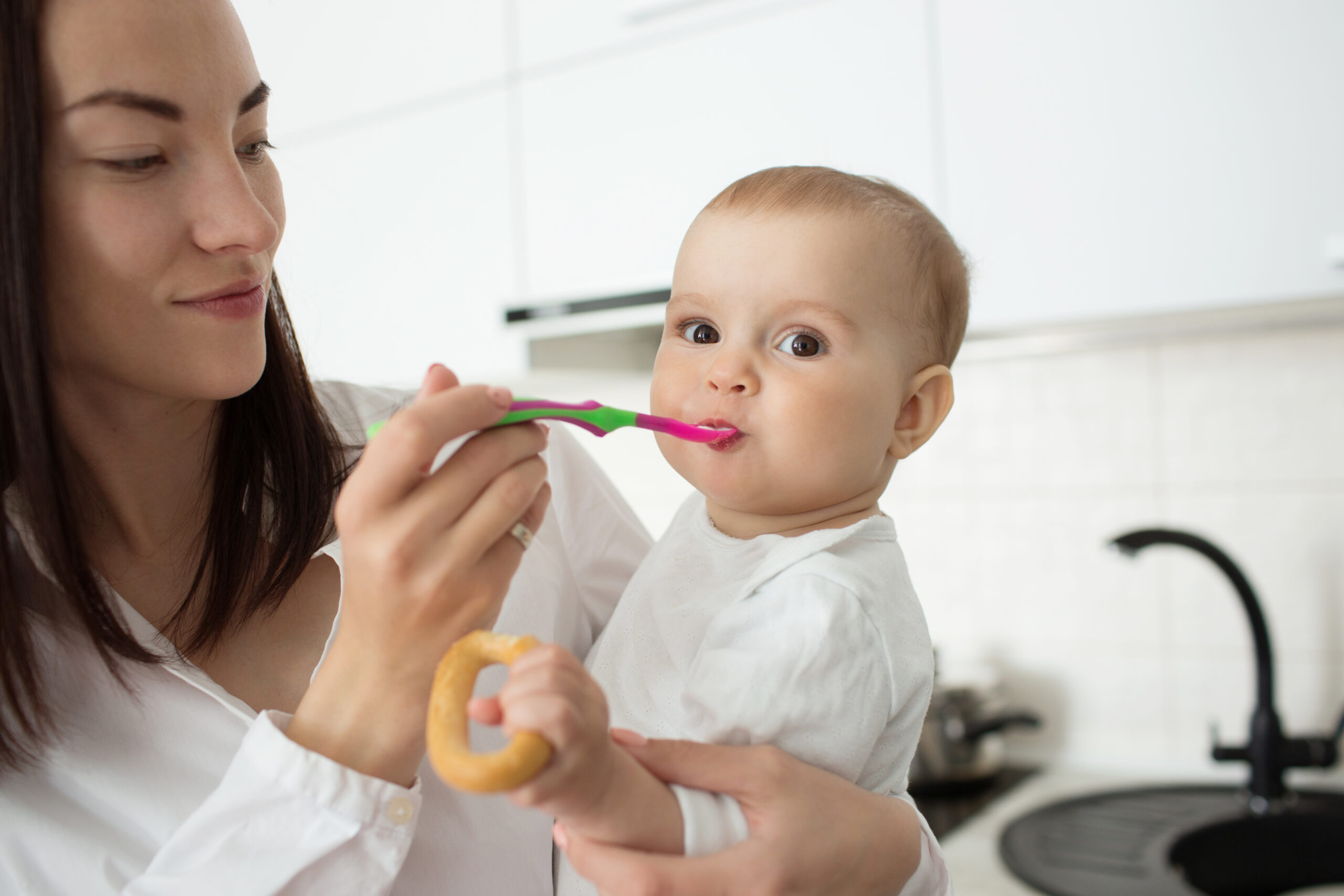 mom feeding her kid